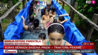 Kubas bērniem baseina prieki – traktora piekabē